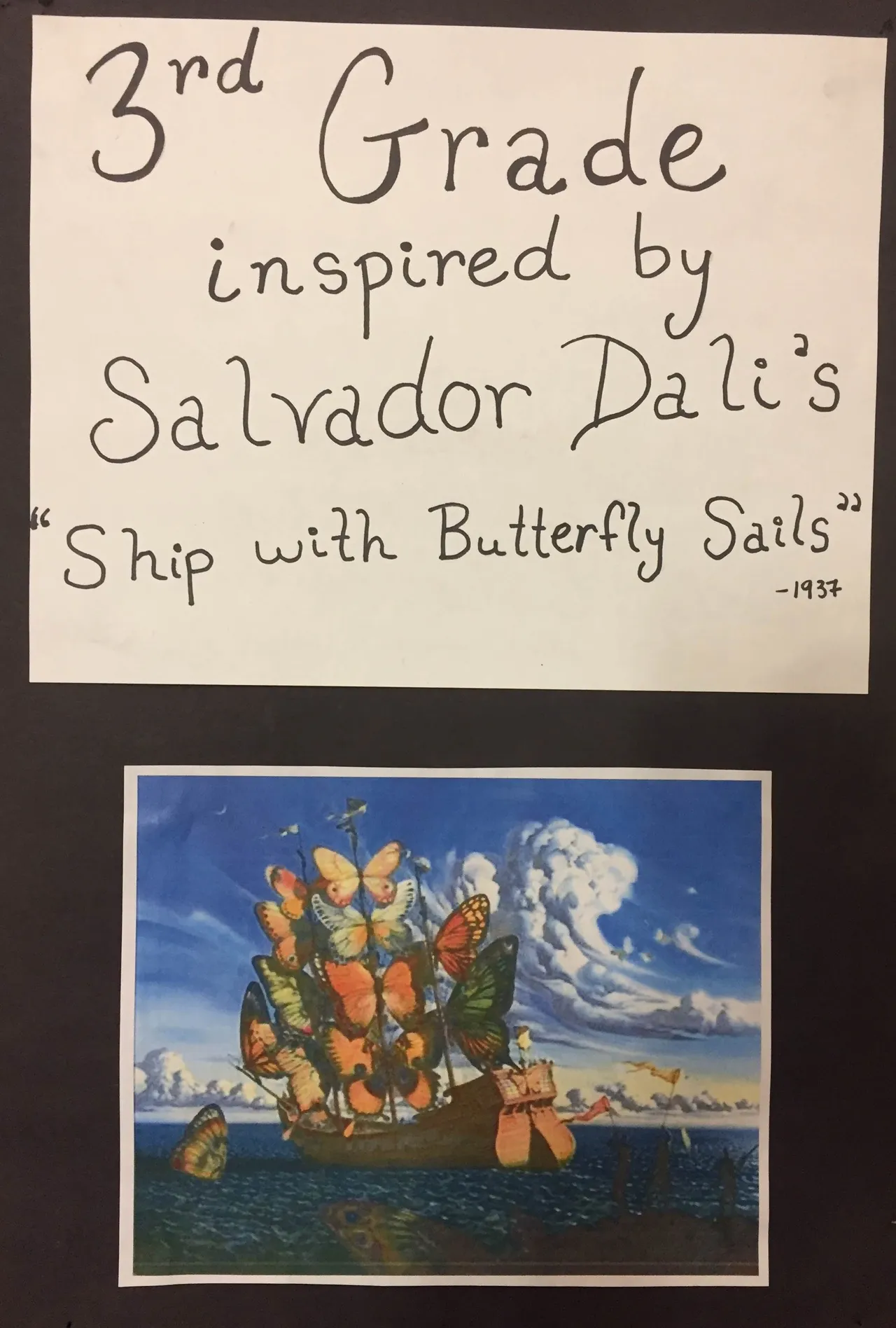 Third-graders drew oil pastel ships with butterfly sails with a tempera paint sky and ocean.