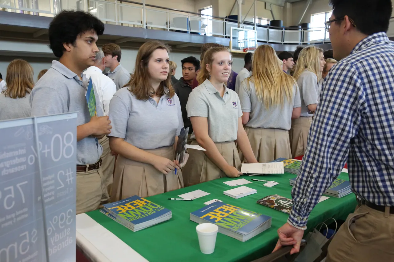 Seniors Tejas Reddy, Olivia Harper and Olivia Barfield meet with a representative from Tulane University.
