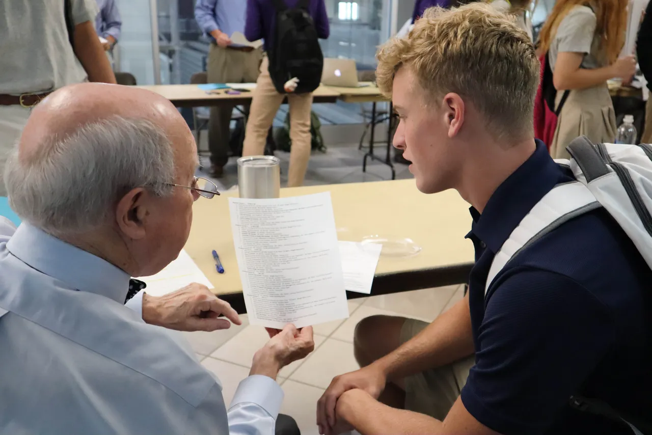 Sam Moss ('63), dean of college guidance, talks with one of his advisees about the college admission process.