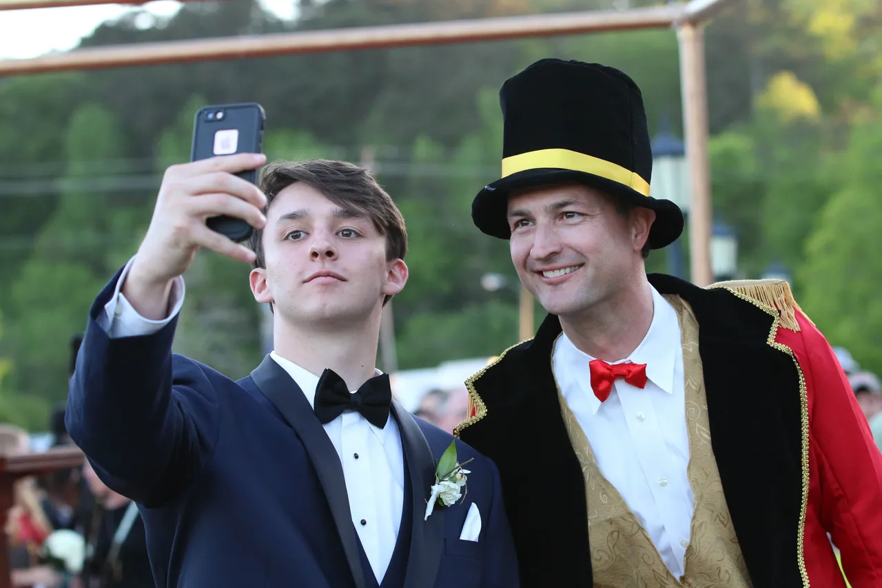 Head of School Brent Bell takes a selfie with a student during our Vintage Circus-themed Prom in 2016.