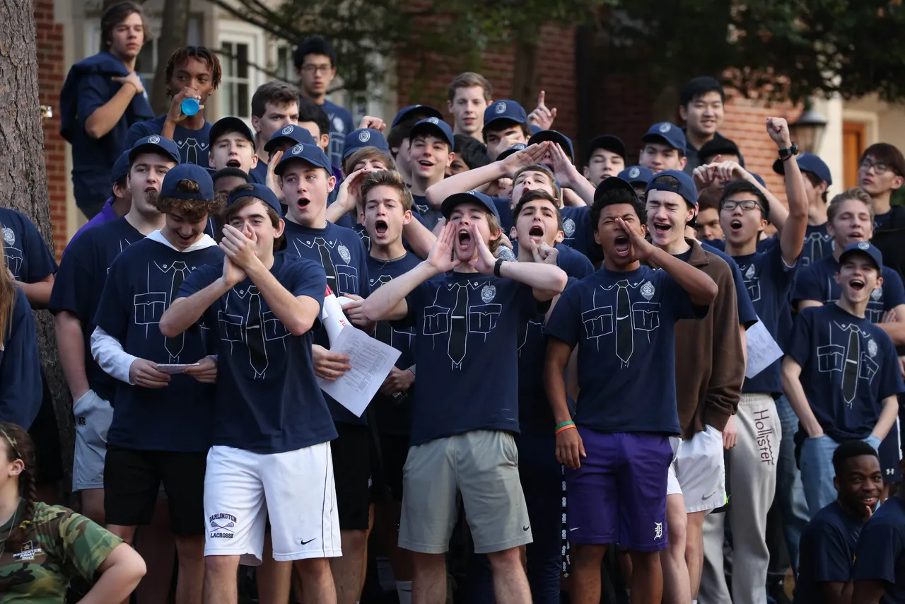 The boys of Moser House cheer for their dormmates during RUMPUS, a weekend-long competition between the day and dorm students in each of the campus houses.
