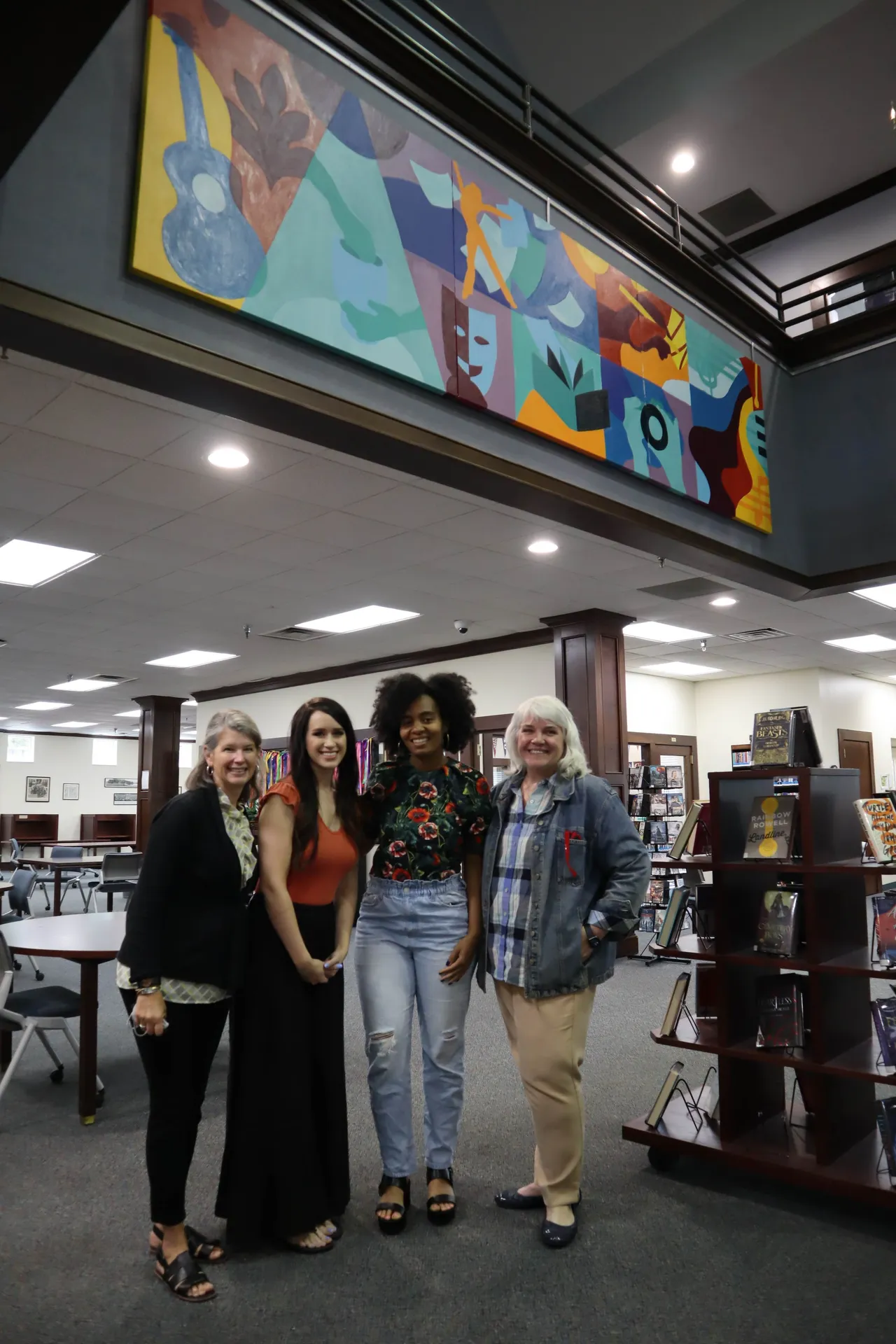 Xaivier Ringer ('04) with me, Ellie Borromeo and Alumni Relations Director Vicki Vincent after our mural was hung in the McCallie-Kennedy Library.