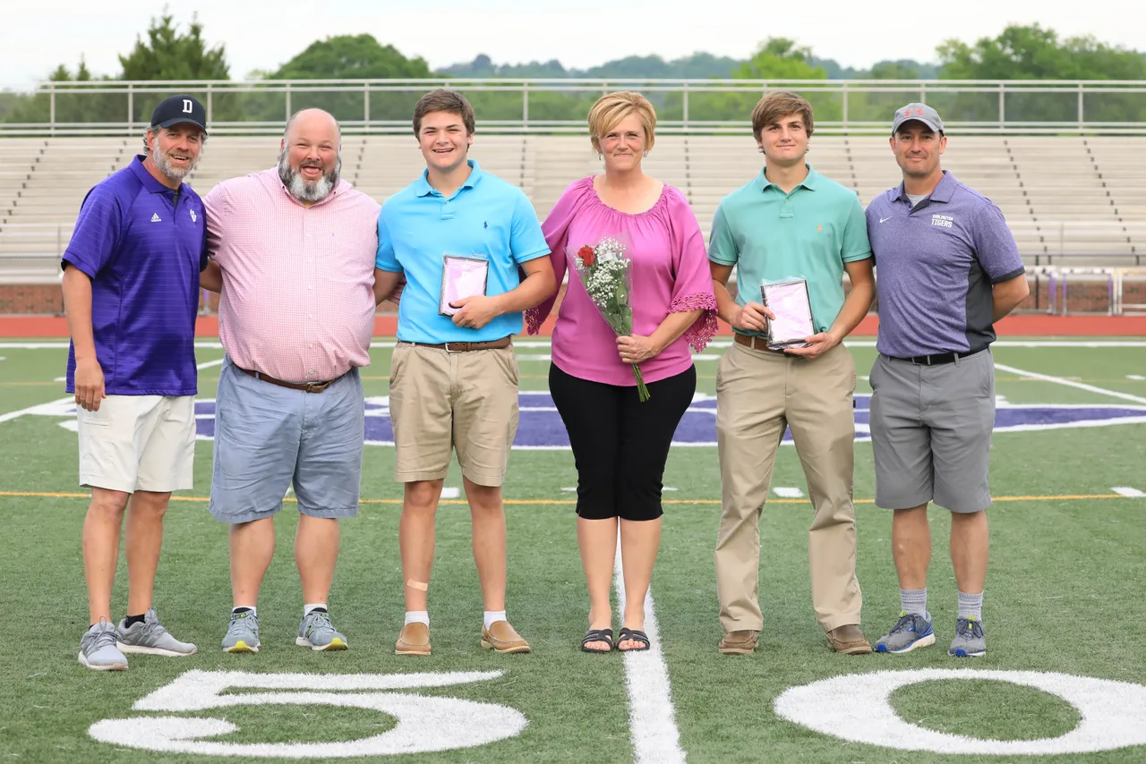 John and Bebe Zazzaro celebrate with their twin sons, Colin ('19) and Casey ('19), during Spring Sports Senior Night.