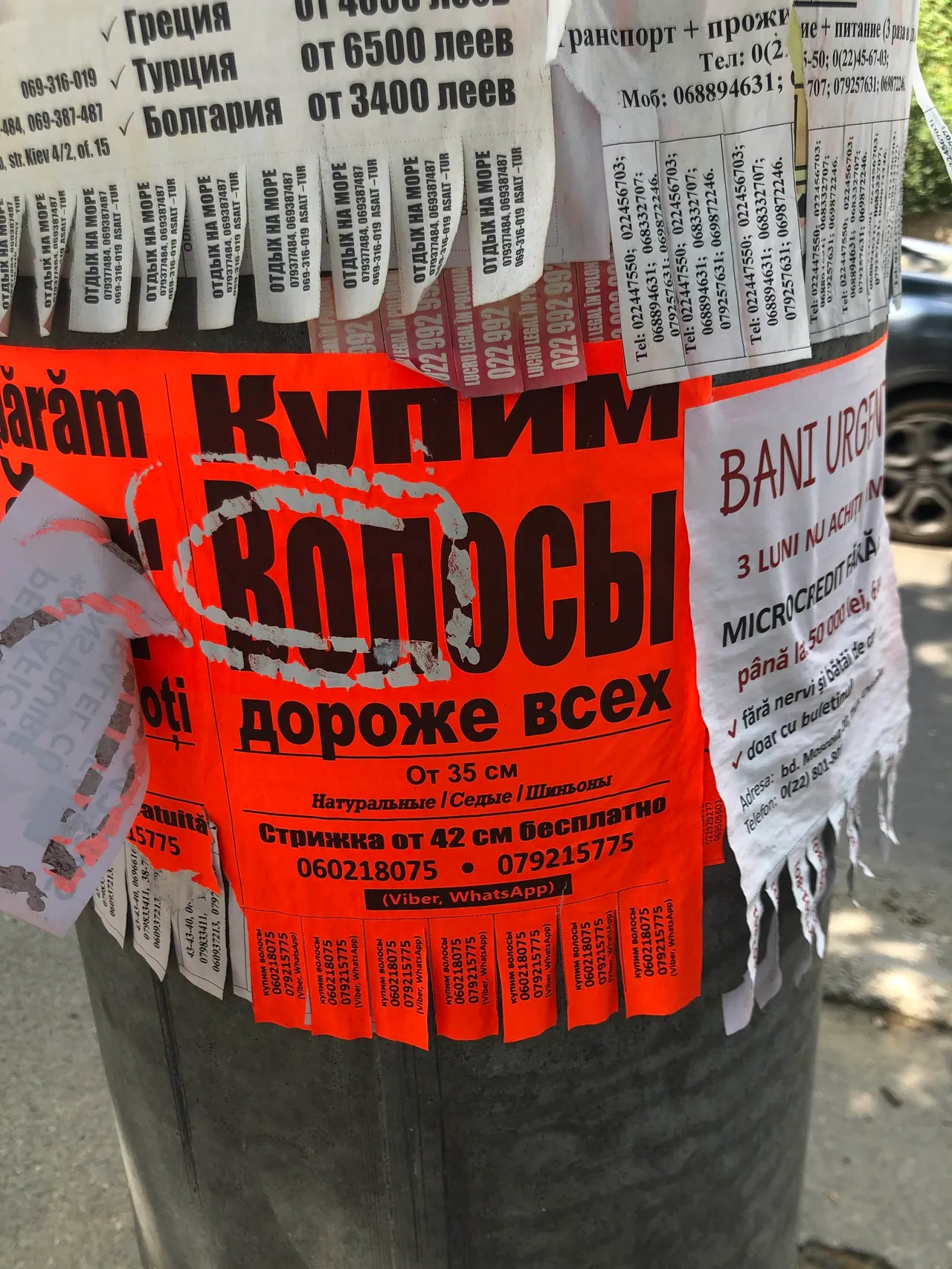 Signs that say ‘we buy hair’ which is a very common sight all throughout the streets of Moldova. Many posters containing financial opportunities are posted, however many are scams.