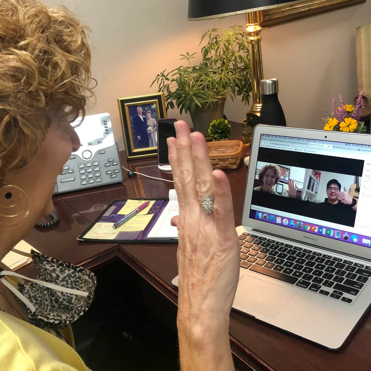 Jan Harrison, executive assistant to the head of school, visits virtually with William Feng (’22), one of her former advisees who is distance learning from Shanghai, China.