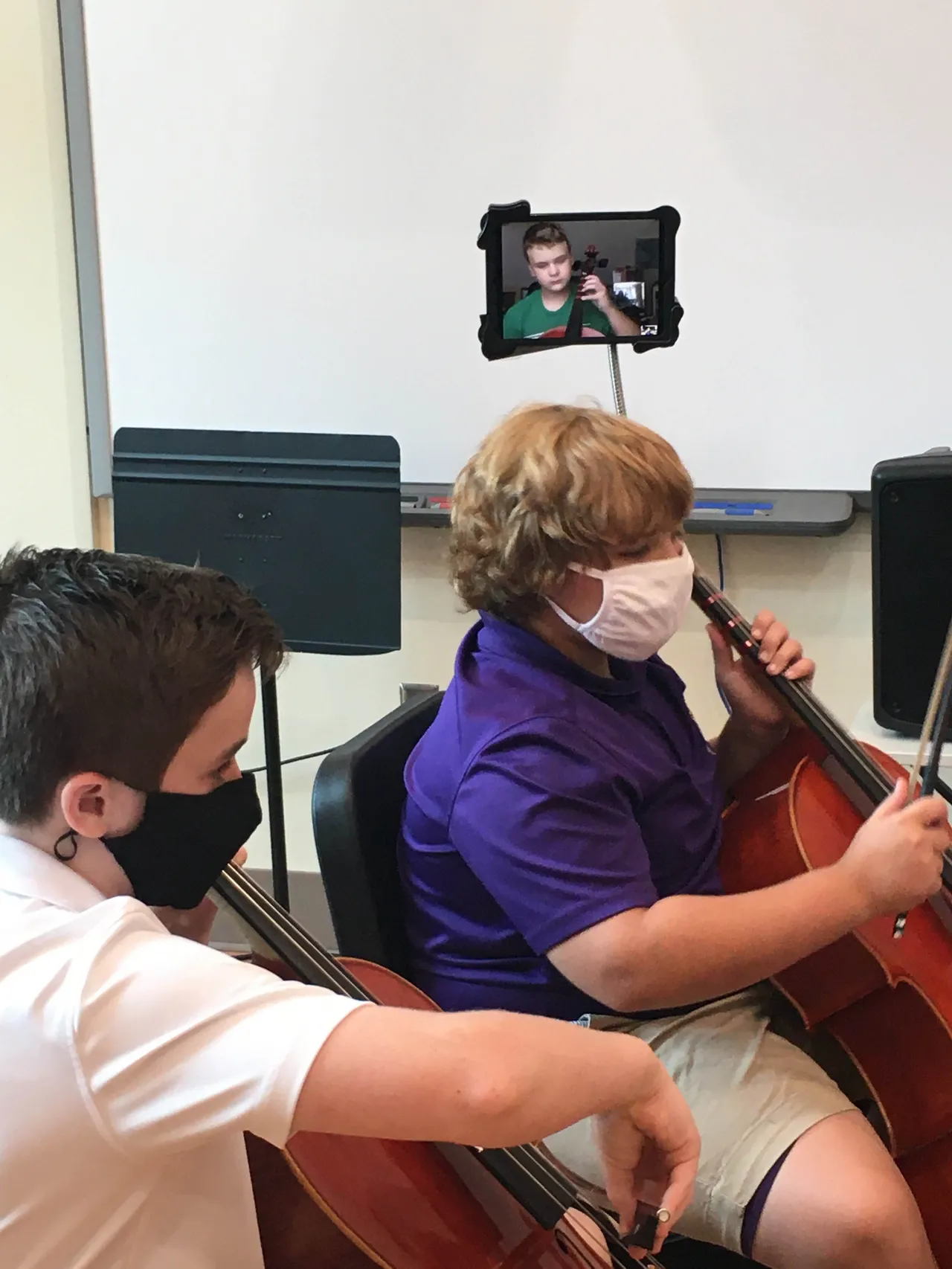 Jackson Preston (’26) rehearses with Jay Watters (‘27), Wyatt Wood (‘26) and the rest of his Orchestra class via iPad.