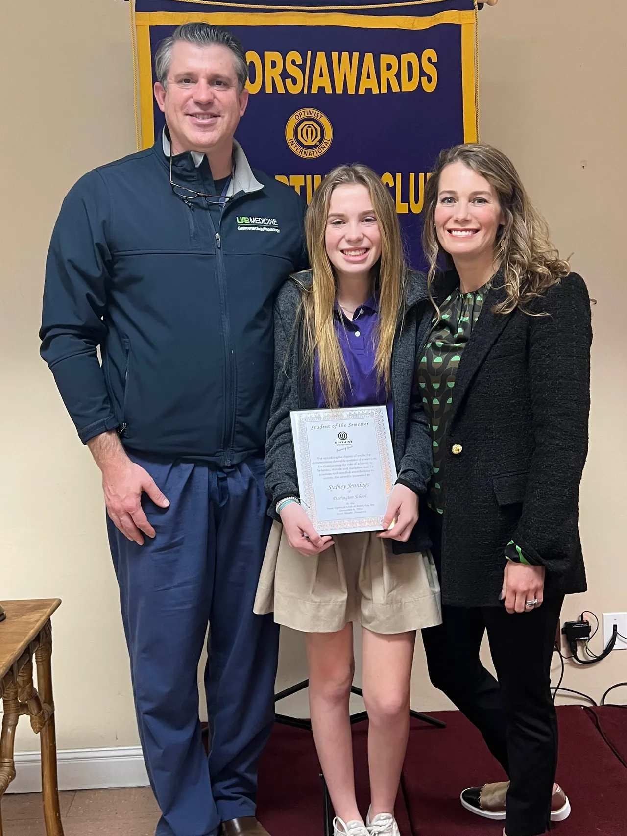 Sydney Jennings with her parents, Ashley and Whitney Jennings