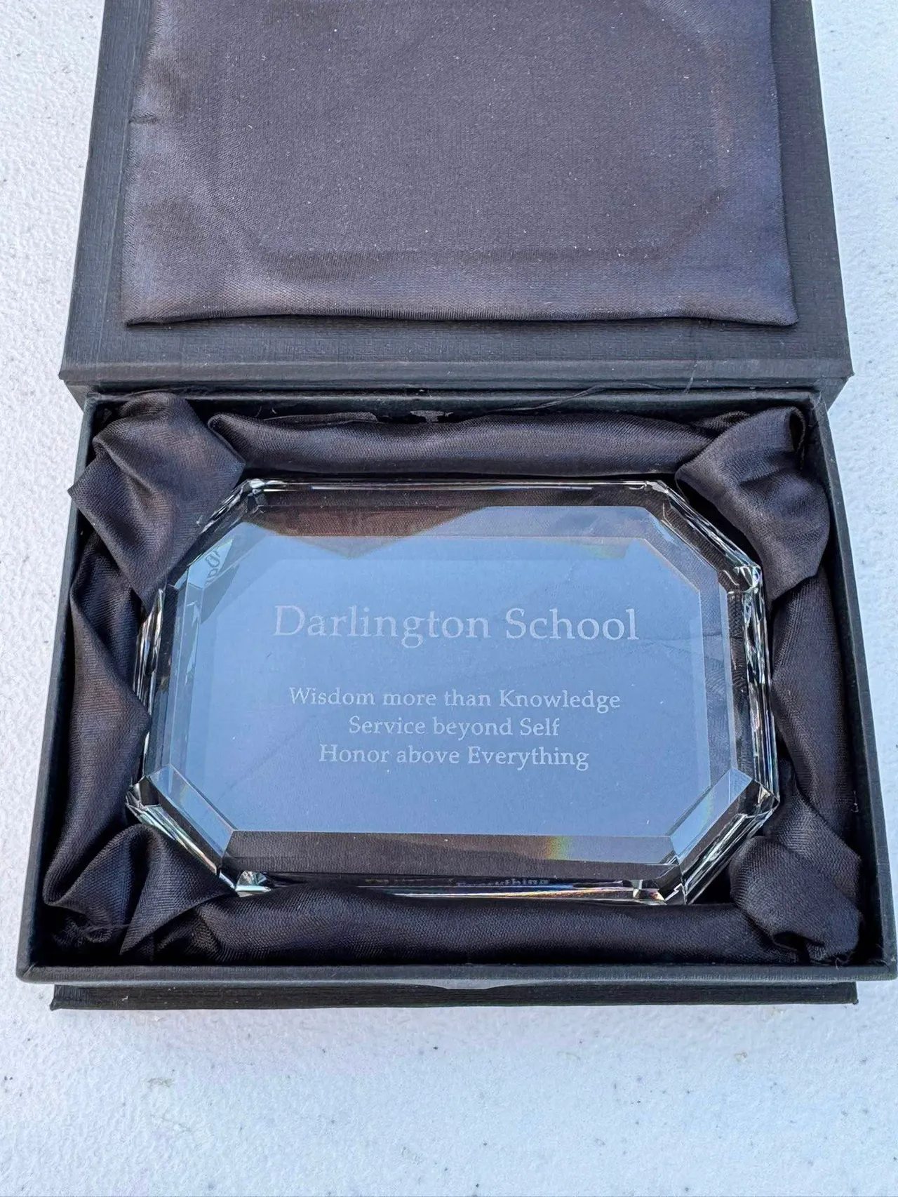John Irby ('81) gifted members of the senior class with glass paperweights engraved with the Darlington motto.
