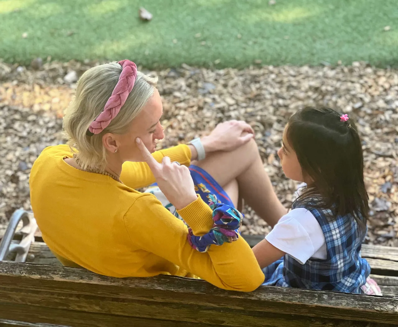 Mason Prep teacher listening to young student
